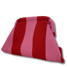 Red and pink striped pillow on a white background