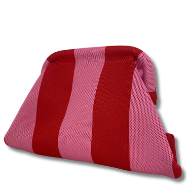 Red and pink striped pillow on a white background