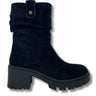 black suede ankle boot with a chunky black block heel and a small silver button detail on the top cuff, shown against a plain white background.