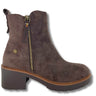 A dark brown suede ankle boot with a side zipper, a chunky dark brown block heel, and a tan welt, shown against a plain white background.