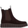 A dark brown suede Chelsea boot with a thick, ribbed platform sole and elastic side gore, shown in profile against a white background.