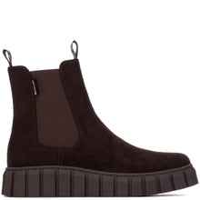 A dark brown suede Chelsea boot with a thick, ribbed platform sole and elastic side gore, shown in profile against a white background.