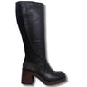 A single black leather knee-high boot with a dark brown wooden block heel and platform, shown from a side profile on a white background.