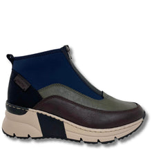 A multi-colored ankle boot with navy blue, olive green, and dark brown panels, featuring a thick beige and black platform sole, shown against a plain white background.