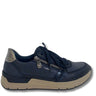 A navy blue slip-on sneaker with a metallic silver heel accent, a silver zipper closure, and a beige midsole, shown from a side profile on a white background.
