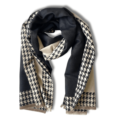 Black and beige houndstooth patterned scarf on a white background
