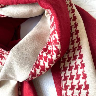 Close-up of red and beige fabric with a houndstooth pattern