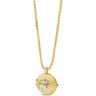 A gold pendant necklace featuring a round gold locket with a winged heart design set with a clear heart-shaped gemstone, suspended from a gold chain on a white background.