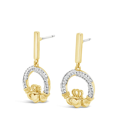 A pair of gold and silver hoop dangle earrings with small flower charms, shown on a plain white background.