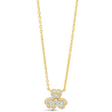 A gold chain necklace with a three-leaf clover pendant, where the center of each leaf is set with a clear round gemstone surrounded by a halo of smaller clear stones, shown on a plain white background.