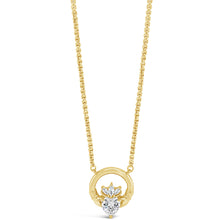 A gold necklace featuring a circular pendant with a central floral motif set with clear gemstones, displayed on a clean white background.