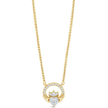 A gold necklace featuring a circular pendant with a central heart-shaped crystal cluster, set against a plain white background.