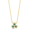 A gold chain necklace with a shamrock pendant featuring three green heart-shaped stones and small clear accent stones, shown on a plain white background.