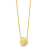 A gold oval pendant necklace with the brand name 'Guess' engraved on the front, accented with small clear stones along the bottom curve, shown on a white background.