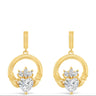 A pair of gold drop earrings featuring a circular ring with a small gold heart-shaped cluster set with clear heart-shaped gemstones, shown on a plain white background.