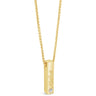 A gold bar pendant necklace with a small clear gemstone and engraved script, hanging from a gold box chain on a white background.