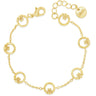 A delicate gold chain bracelet featuring multiple small circular links, each adorned with a tiny flower motif, displayed on a clean white background. One of the circular links is engraved with the brand name 'cléop'.