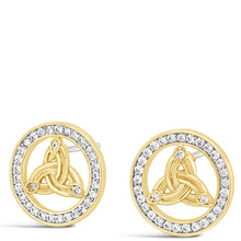 A pair of gold-toned stud earrings with a central seated figure motif surrounded by a halo of small clear stones, shown on a plain white background.