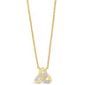 A gold chain necklace with a triquetra knot pendant, featuring small clear pavé stones on two of the interlocking loops, set against a plain white background.
