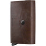 A dark brown leather wallet with a snap-button closure and a visible 'RE:INVIT' logo on the front, shown against a plain white background.