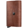 A brown leather wallet with a snap-button closure and a visible 'REDGEEK' brand stamp on the front, shown against a plain white background.