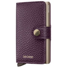 A purple textured leather wallet case with a gold-toned metal cardholder and snap button closure, branded 'SECRID'.