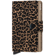 A compact wallet-style card case with a leopard print pattern in tan, brown, and black, featuring a snap-button closure and a side tab branded 'SICRID'.
