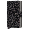 A Secrid Mini wallet featuring a black and gray leopard print pattern on the front cover, with a dark gray metal side bar and a snap-button strap closure.