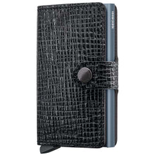 A black textured leather wallet case with a snap-button closure and a slim metallic blue-gray side strip branded SECRID, shown on a plain white background.