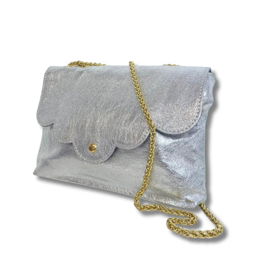 Silver clutch bag with a gold chain on a white background