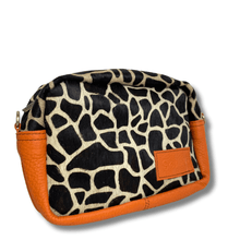Cosmetic bag with giraffe pattern and orange accents on a white background