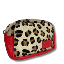 Leopard print pouch with red accents on a white background
