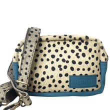 Polka dot handbag with blue accents and 'Boruko' branding on a white background