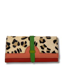Leopard print wallet with a green strap and red base on a white background