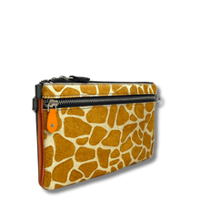 Giraffe patterned pouch with orange zipper on a white background