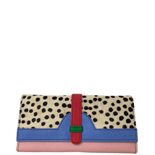 Multicolored clutch bag with polka dot pattern on a white background