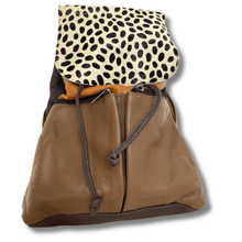 Brown leather bag with a leopard print top section on a white background