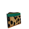 A small zip-around card holder or wallet with a leopard print front panel, a teal green leather top section, and tan leather trim, shown on a plain white background.