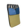 A color-blocked leather phone pouch with a zebra-print top section, a blue leather flap, and a tan textured leather base. The brand name 'Souria' is embossed on the blue flap.