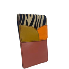 A small leather card holder or wallet with a patchwork design, featuring a zebra print top section, a mustard yellow pebbled panel, an orange leather panel, and a dusty rose bottom panel.