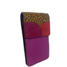 A color-blocked leather pouch with a leopard-print top flap, a magenta leather pocket, and a purple leather lower section, shown on a plain white background.