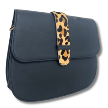 black handbag with a leopard print strap on a white background