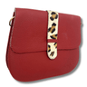 Red handbag with a leopard print strap on a white background