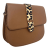 Brown leather handbag with a leopard print strap on a white background