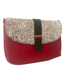 Red handbag with a patterned flap on a white background