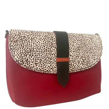 Red handbag with a patterned flap on a white background