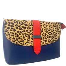 Handbag with leopard print top flap and blue body on a white background