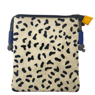 Small pouch with black abstract pattern on beige fabric, blue straps, and yellow tag.