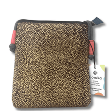 Patterned pouch with a visible brand tag on a white background