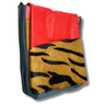 Multicolored leather pouch with red, yellow, and black patterns on a white background